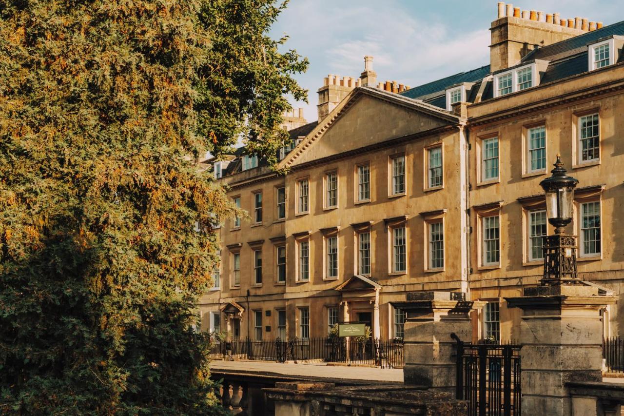 a building with a canal in front of it at Parade Hotel Bath in Bath